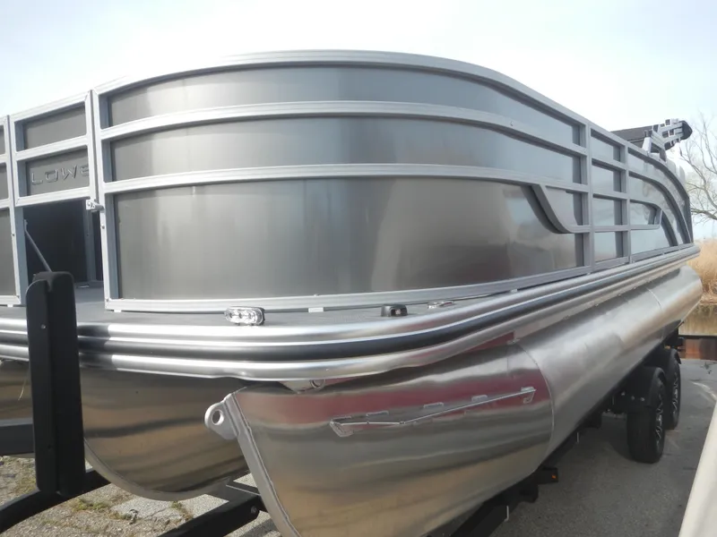 Slide: The Image of 2024 Lowe SF 212 WT pontoon boat, front view, on a trailer. - 5