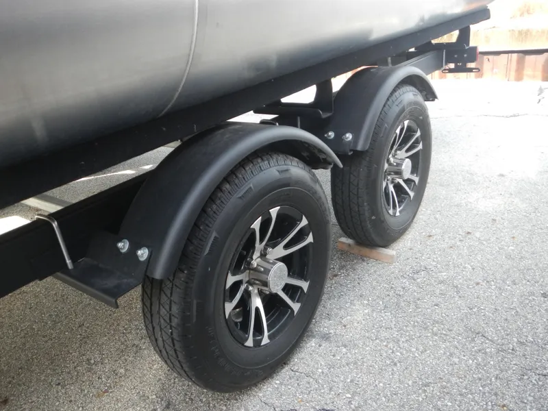 Slide: The Image of Close-up of 2024 Lowe SF 212 WT boat trailer wheels. - 9