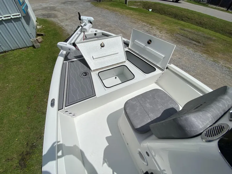 Slide: The Image of 2024 Avid 19FSX boat with open storage compartments and seating. - 4