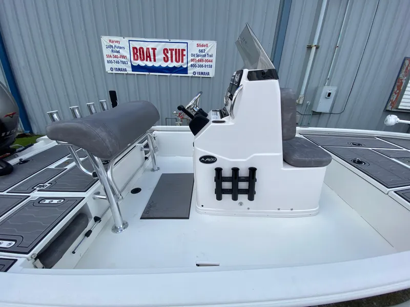 Slide: The Image of 2024 Avid 19FSX boat interior with seating and control console. - 8