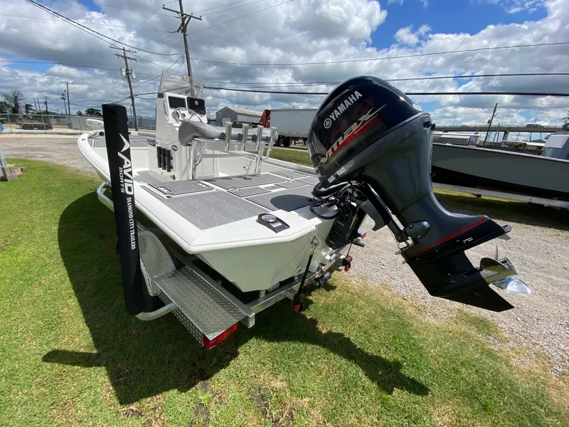 Slide: The Image of 2024 Avid 19FSX boat with Yamaha outboard motor on trailer. - 9