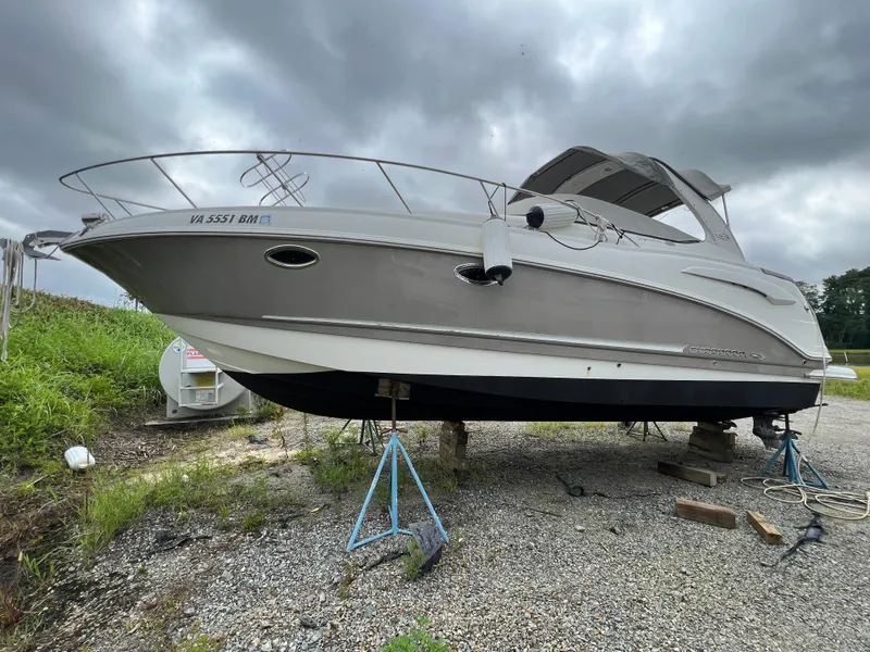 Slide: The Image of 2008 Chaparral Signature 290 boat on stands, overcast sky background. - 1