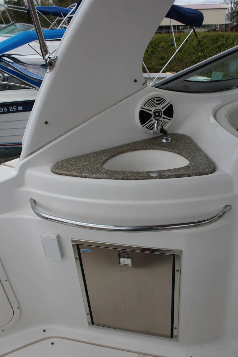 Slide: The Image of 2008 Chaparral Signature 290 boat interior with sink and storage compartment. - 17