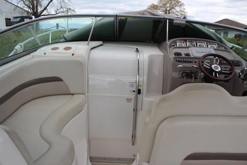 Slide: The Image of 2008 Chaparral Signature 290 boat interior with helm, seating, and navigation equipment. - 19
