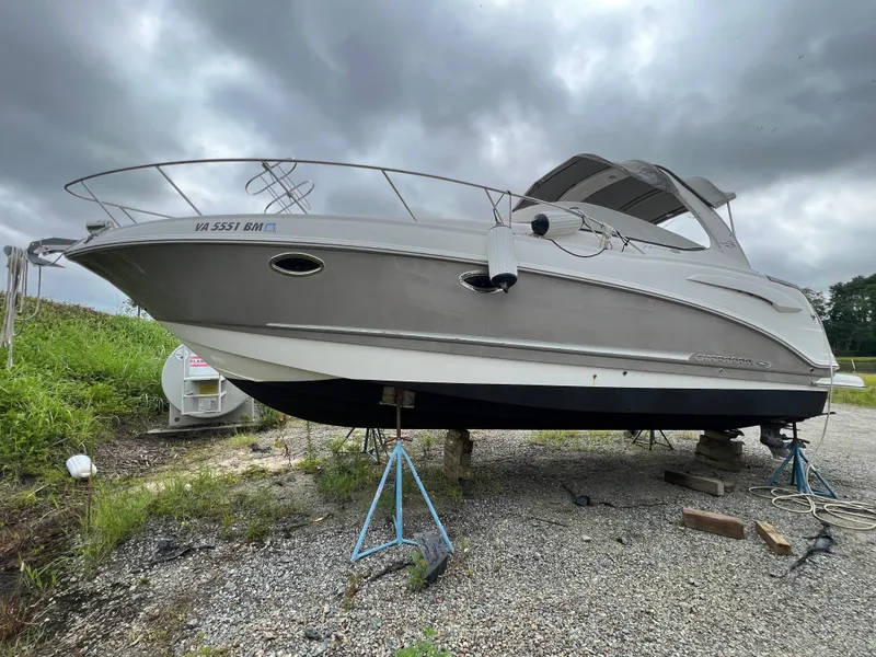 Slide: The Image of 2008 Chaparral Signature 290 boat on stands, overcast sky background. - 2