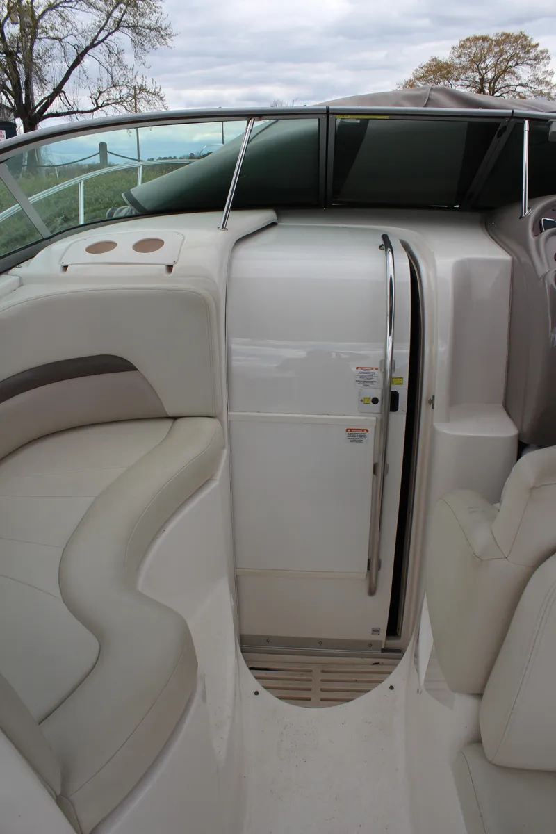 Slide: The Image of 2008 Chaparral Signature 290 boat interior with seating and cabin door. - 20