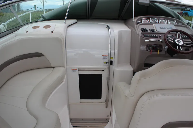 Slide: The Image of 2008 Chaparral Signature 290 boat interior with steering wheel and seating area. - 21
