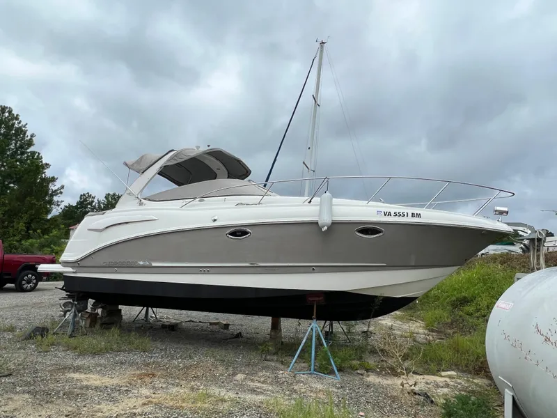 Slide: The Image of 2008 Chaparral Signature 290 boat on land, overcast sky background. - 4