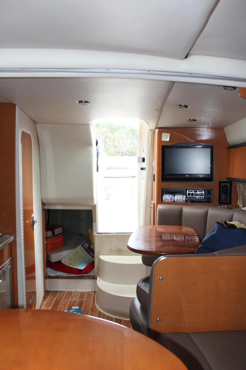Slide: The Image of Interior of 2008 Chaparral Signature 290 boat with seating, TV, and storage. - 41