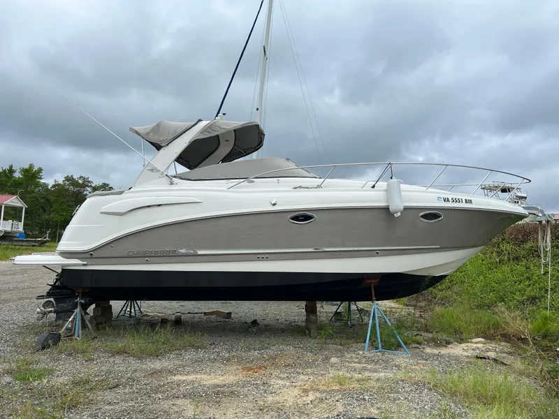 Slide: The Image of 2008 Chaparral Signature 290 boat on stands, overcast sky background. - 5