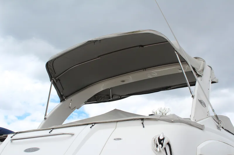 Slide: The Image of 2008 Chaparral Signature 290 boat with canopy under cloudy sky. - 6