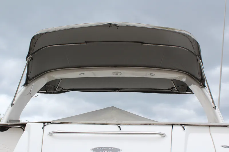 Slide: The Image of 2008 Chaparral Signature 290 boat with canopy against cloudy sky. - 8