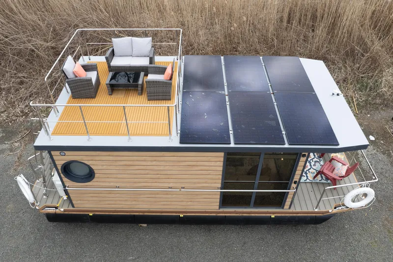 Slide: The Image of 2024 Waterlodge Apart M houseboat with rooftop deck and solar panels. - 10