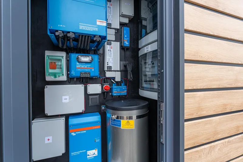 Slide: The Image of Electrical control panel inside Waterlodge Apart M 2024 model, showcasing various components and wiring. - 30