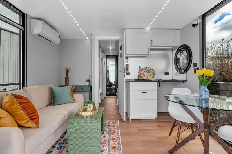 Slide: The Image of Modern interior of 2024 Waterlodge Apart M with cozy living area and kitchenette. - 5