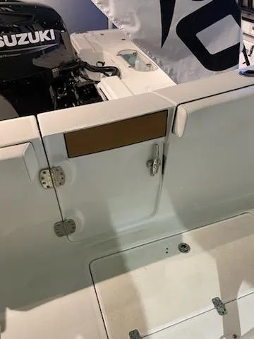 Slide: The Image of 2024 Sea Pro 259 Sport boat with Suzuki engine, rear deck view. - 14