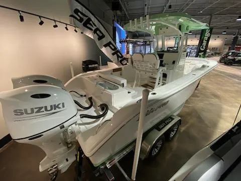 Slide: The Image of 2024 Sea Pro 259 Sport boat with dual Suzuki engines on display. - 5