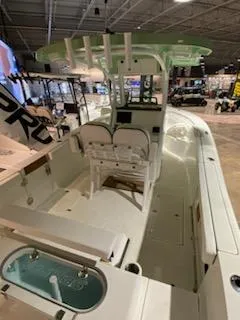 Slide: The Image of 2024 Sea Pro 259 Sport boat interior at a showroom. - 6