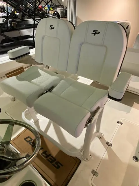 Slide: The Image of 2024 Sea Pro 259 Sport boat with dual white captain's chairs. - 9