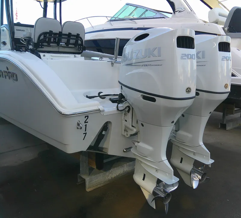 Slide: The Image of 2020 Sea Pro 259 Center Console with twin Suzuki outboard motors. - 10
