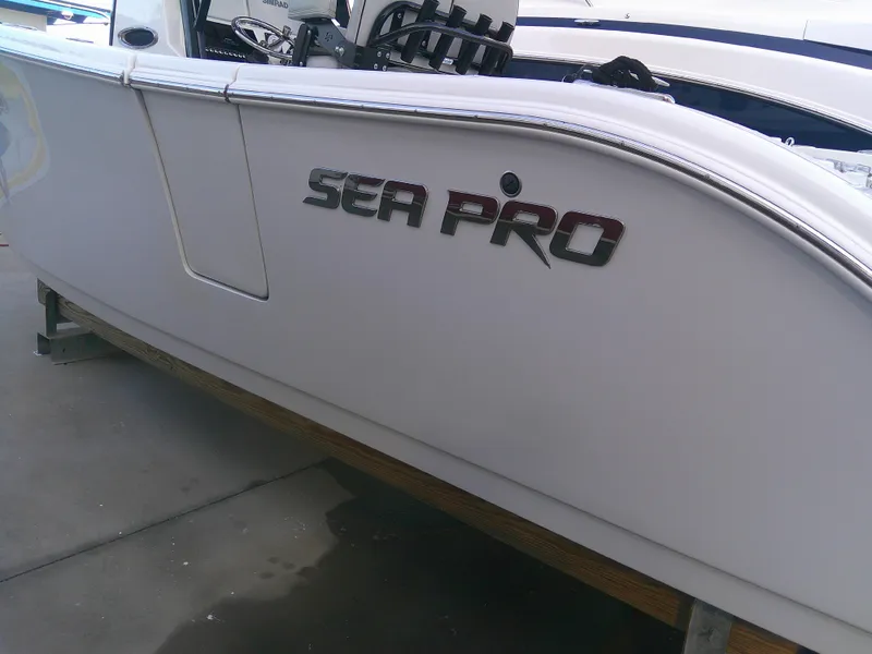 Slide: The Image of 2020 Sea Pro 259 Center Console boat side view with logo. - 11