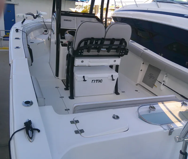 Slide: The Image of 2020 Sea Pro 259 Center Console boat interior with seating and storage. - 12