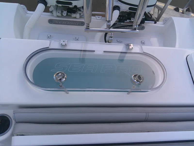 Slide: The Image of 2020 Sea Pro 259 Center Console boat livewell with clear lid and stainless steel fittings. - 13