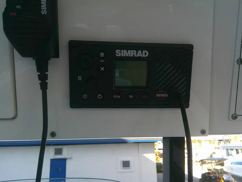 Slide: The Image of Simrad marine radio on 2020 Sea Pro 259 Center Console boat. - 16