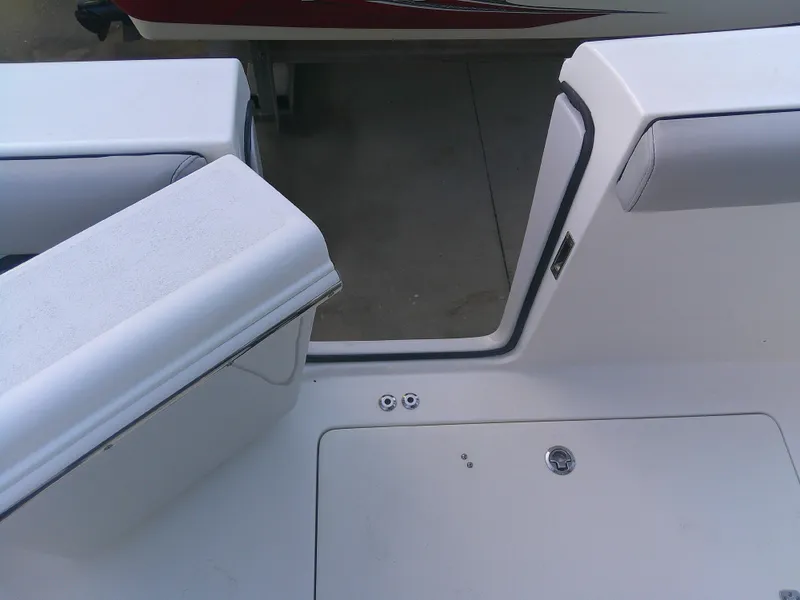 Slide: The Image of 2020 Sea Pro 259 Center Console boat interior with open hatch and seating. - 21