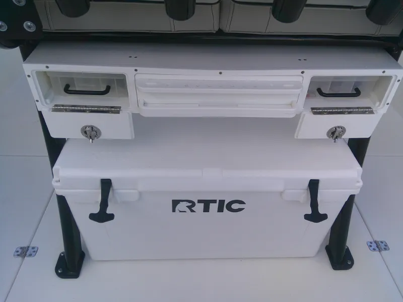 Slide: The Image of 2020 Sea Pro 259 Center Console with RTIC cooler and storage compartments. - 23