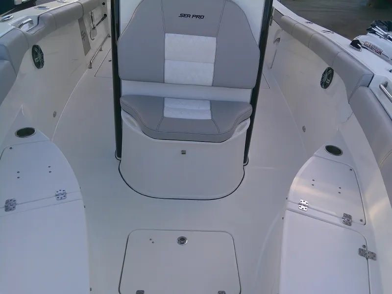 Slide: The Image of 2020 Sea Pro 259 Center Console boat interior with seating and storage compartments. - 29