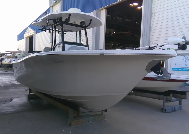 Slide: The Image of 2020 Sea Pro 259 Center Console boat in a marina setting. - 3