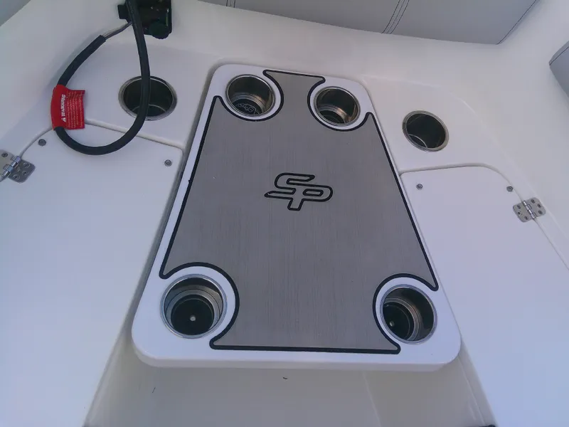 Slide: The Image of 2020 Sea Pro 259 Center Console boat deck with cup holders and logo. - 32