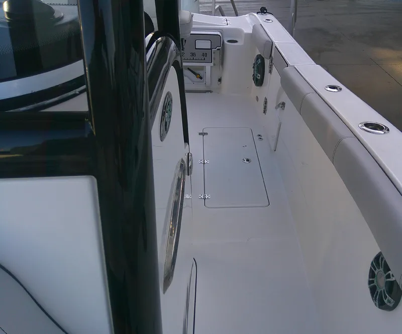 Slide: The Image of 2020 Sea Pro 259 Center Console boat interior, featuring sleek design and spacious deck. - 33