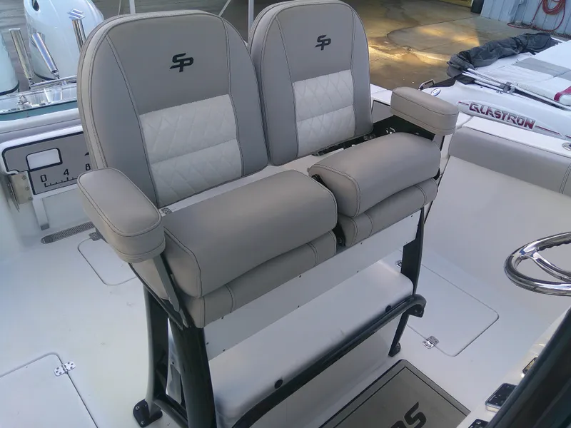 Slide: The Image of 2020 Sea Pro 259 Center Console boat seats with armrests and logo. - 35