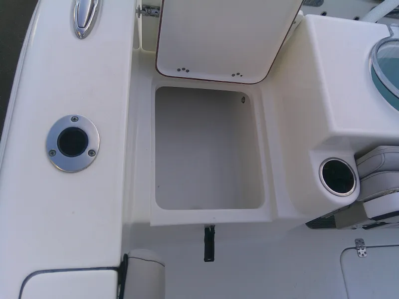 Slide: The Image of 2020 Sea Pro 259 Center Console boat storage compartment and seating area. - 38