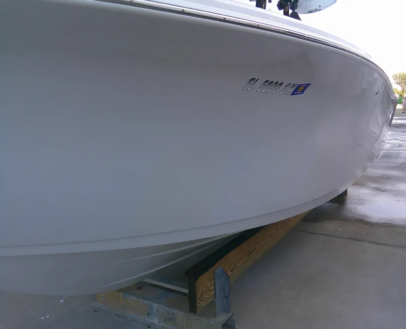 Slide: The Image of 2020 Sea Pro 259 Center Console boat on a trailer, side view. - 6