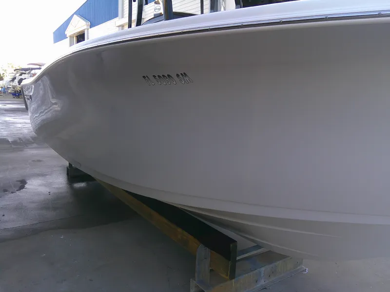 Slide: The Image of 2020 Sea Pro 259 Center Console boat on a trailer, side view. - 7