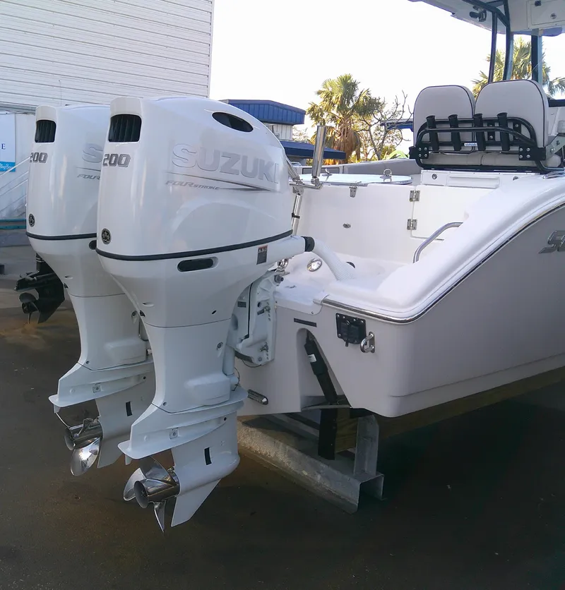 Slide: The Image of 2020 Sea Pro 259 Center Console with dual Suzuki outboard motors. - 8