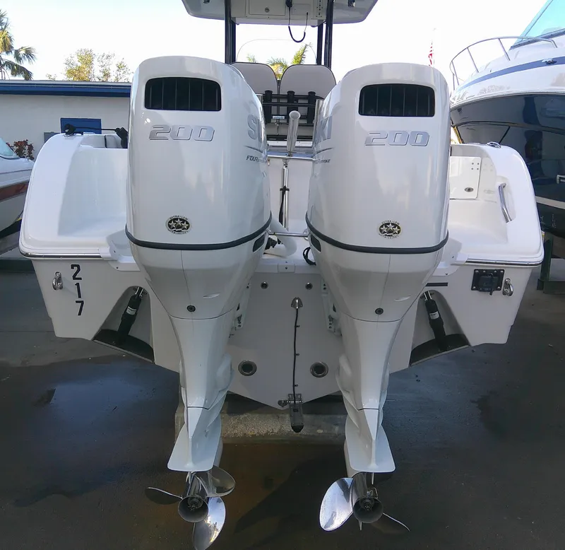 Slide: The Image of 2020 Sea Pro 259 Center Console with twin 200 horsepower engines, rear view. - 9