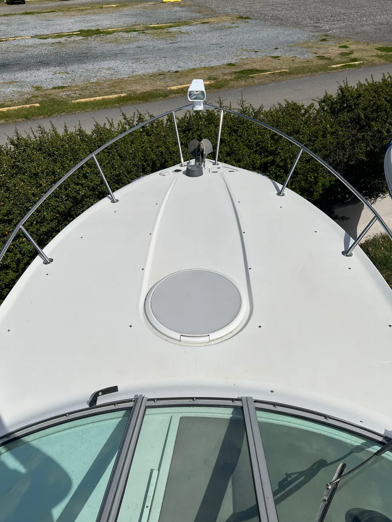 Slide: The Image of 2003 Four Winns 268 Vista boat bow with anchor and hatch. - 13