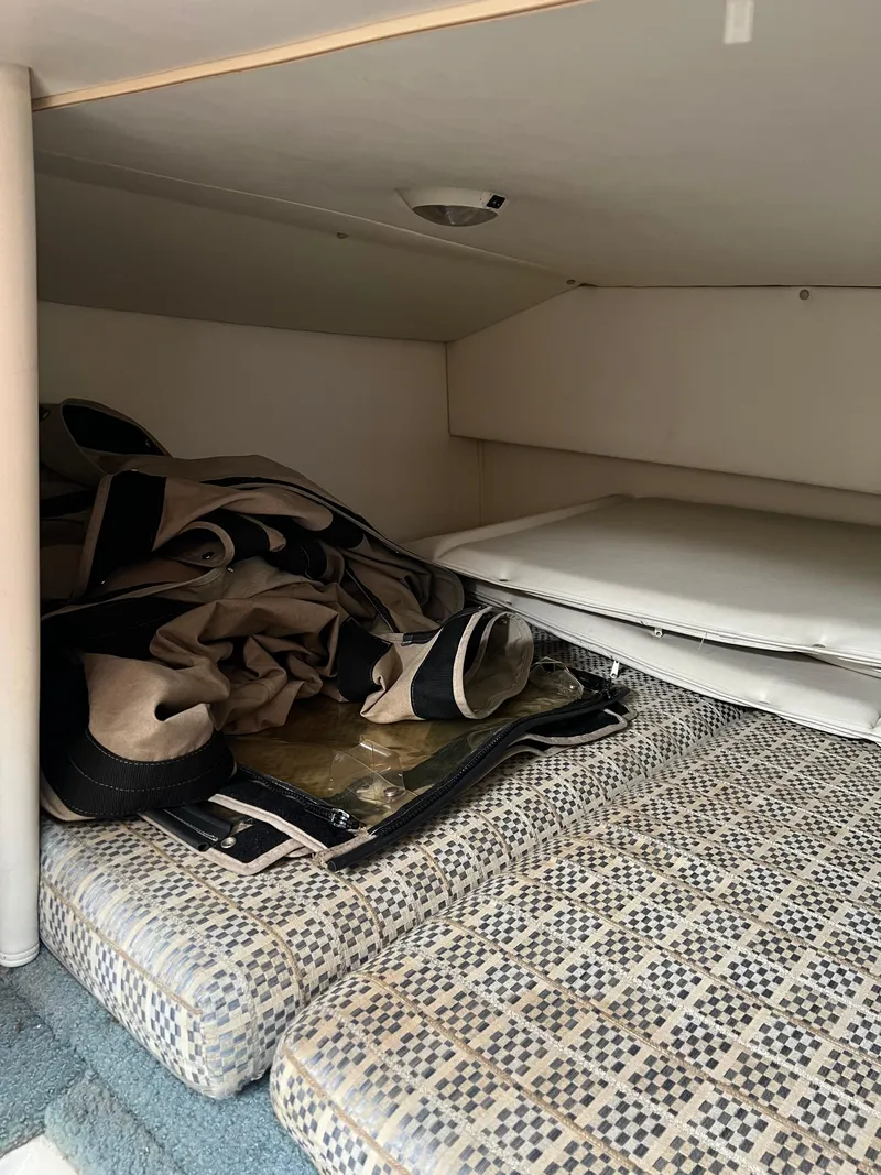 Slide: The Image of Interior cabin storage area of a 2003 Four Winns 268 Vista boat. - 35