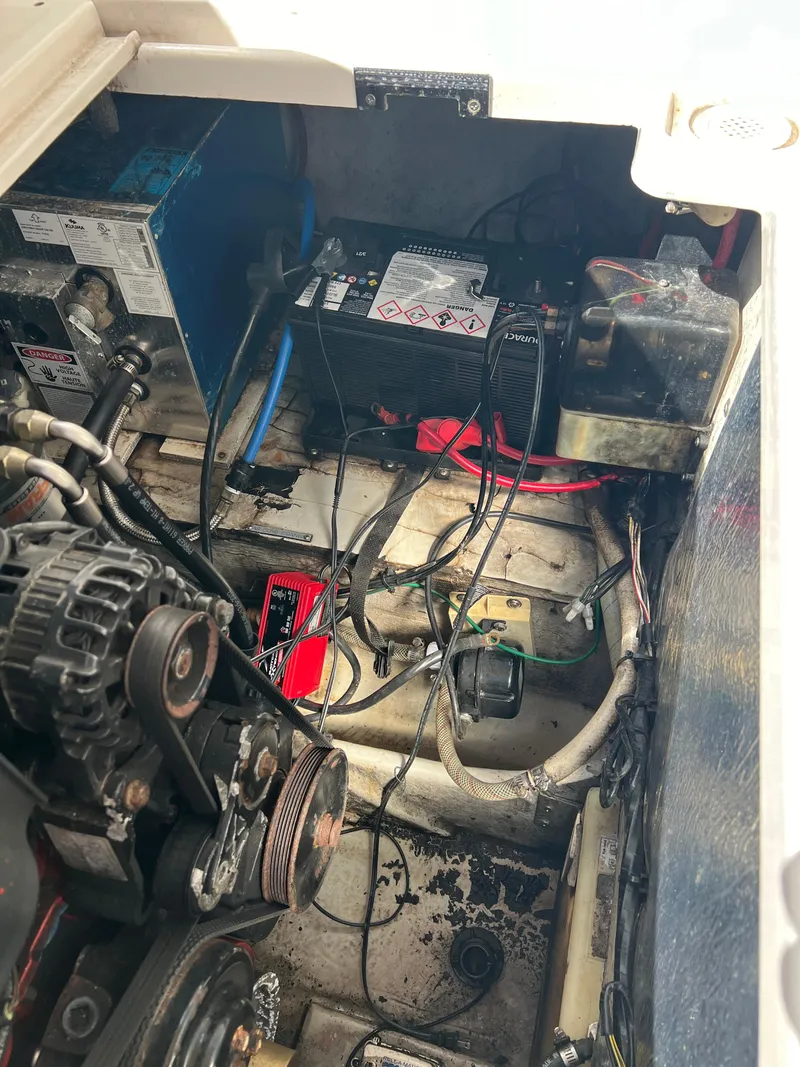 Slide: The Image of 2003 Four Winns 268 Vista engine compartment with battery and wiring. - 37