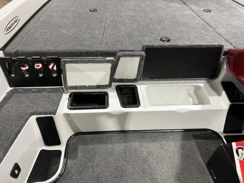 Slide: The Image of 2024 Phoenix 819 Pro boat interior with storage compartments and control panel. - 10