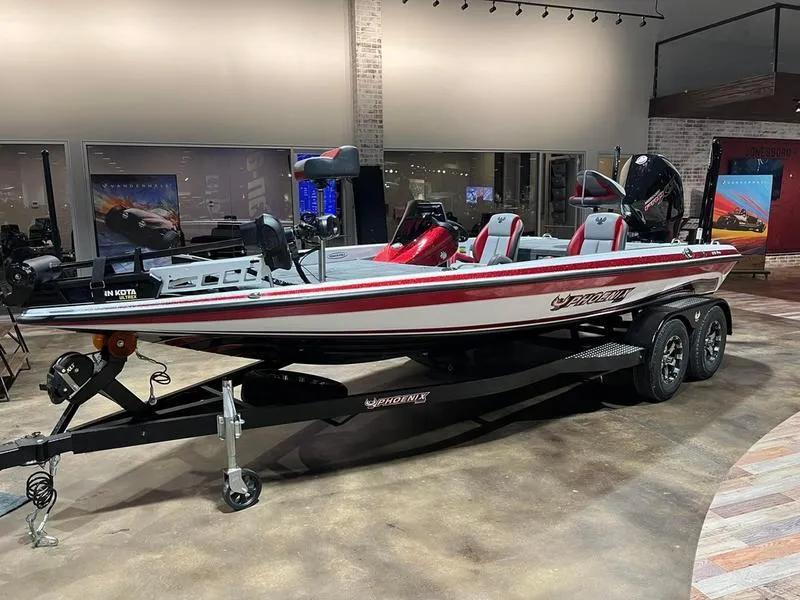 Slide: The Image of 2024 Phoenix 819 Pro bass boat on display in showroom. - 2