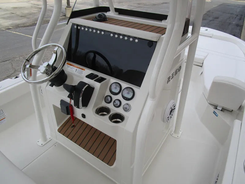 Slide: The Image of 2024 Ranger 2360 Bay boat console with steering wheel and control panel. - 21