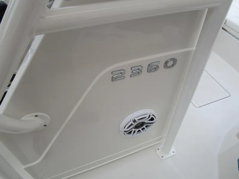 Slide: The Image of 2024 Ranger 2360 Bay boat interior detail with model number and speaker. - 24