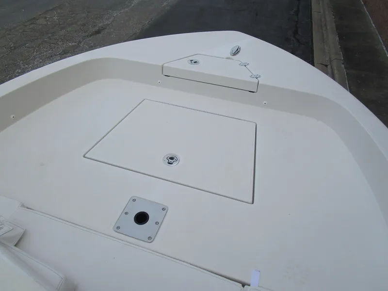 Slide: The Image of 2024 Ranger 2360 Bay boat deck with storage compartments. - 27
