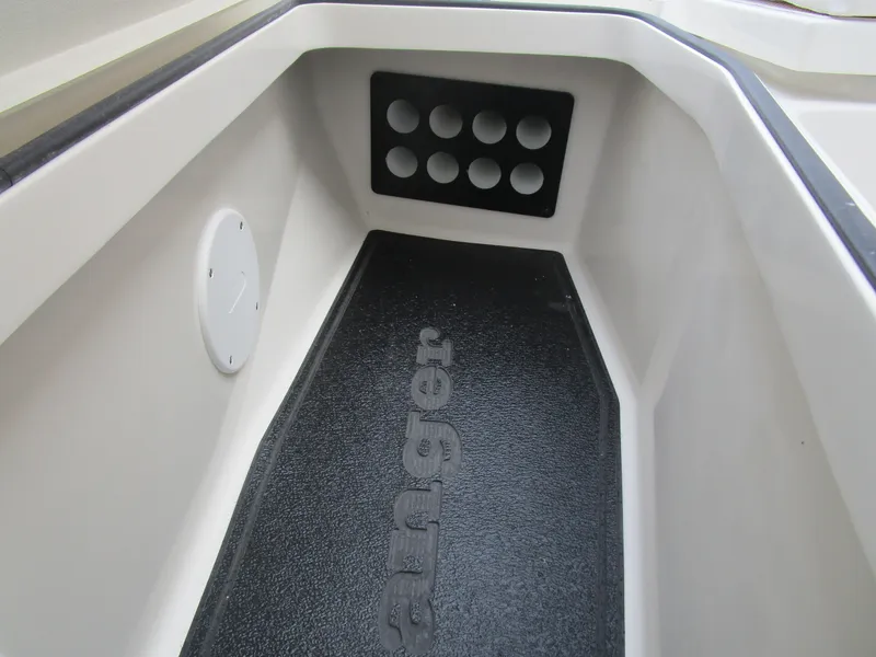 Slide: The Image of 2024 Ranger 2360 Bay boat interior with rod holders and non-slip flooring. - 31