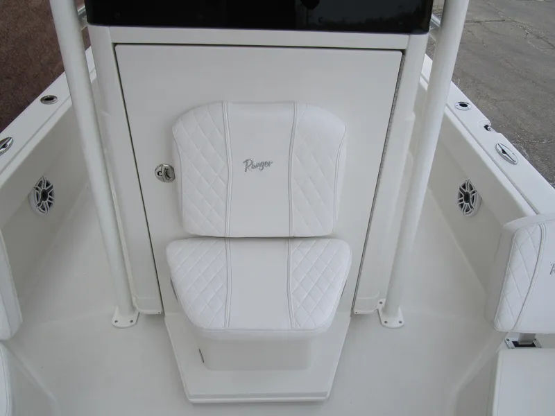 Slide: The Image of 2024 Ranger 2360 Bay boat with white cushioned seating. - 33